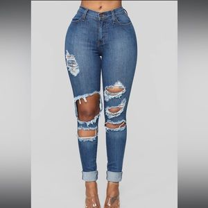 Medium blue mid rise ripped skinny Jean